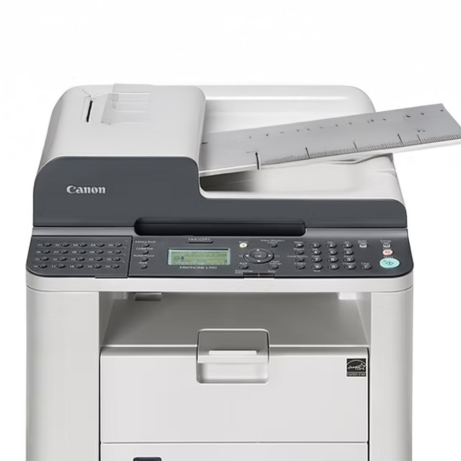 Canon multifunction fax and copy machine with keypad controls and a paper tray on top.