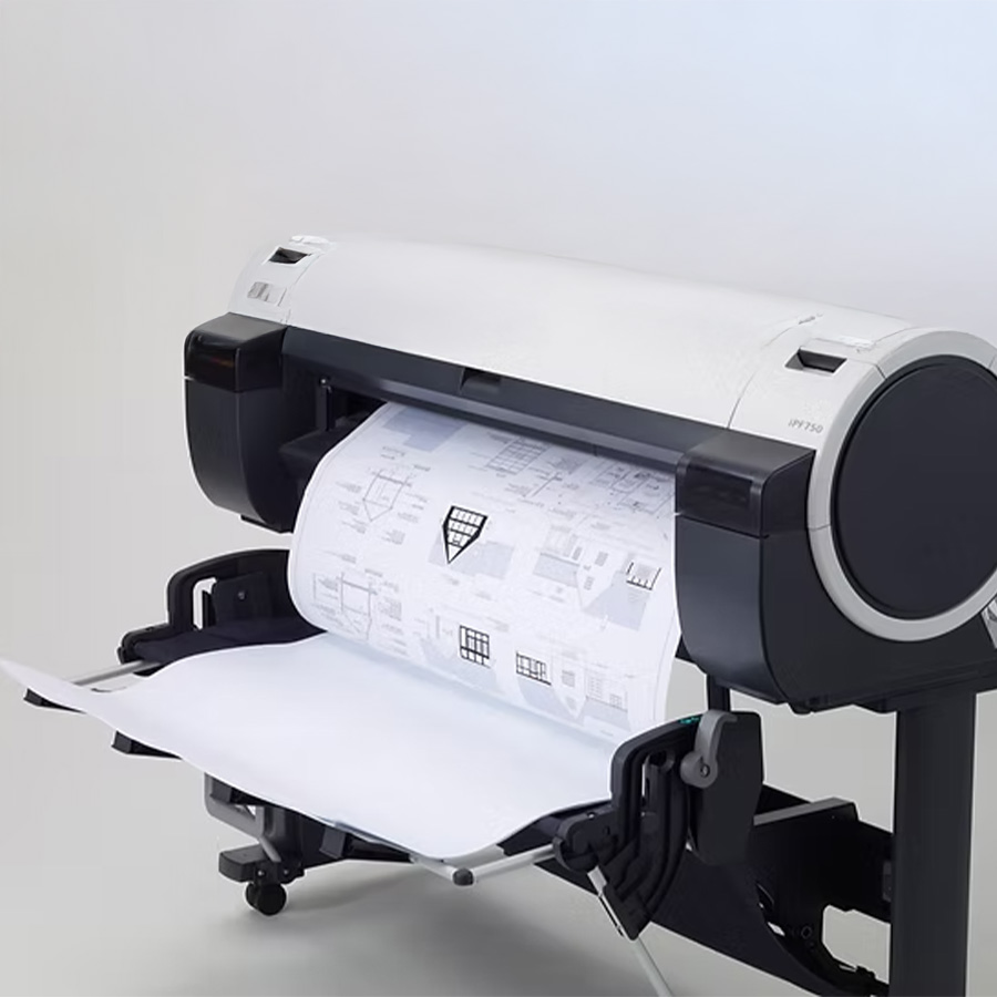 Large-format printer producing an architectural blueprint on rolled paper.